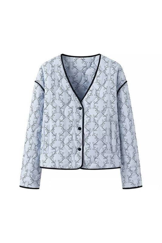 Abrigo de invierno con ribete en contraste y botones estampados