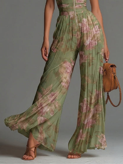 Mono de gasa verde sin mangas con estampado floral y cremallera.