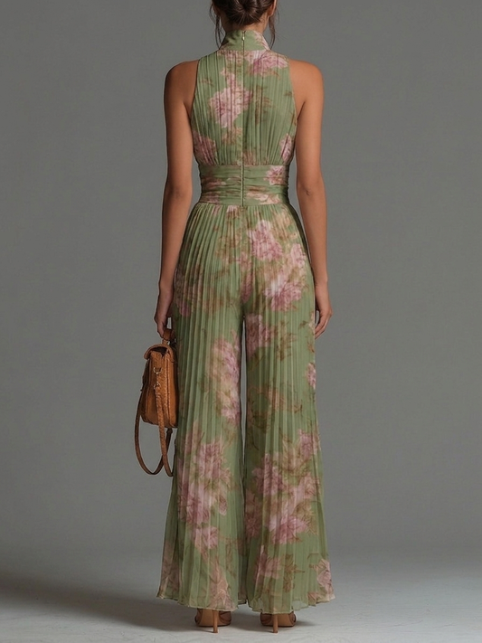 Mono de gasa verde sin mangas con estampado floral y cremallera.
